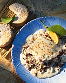 Cod fillet on wild rice with goat's cheese sauce