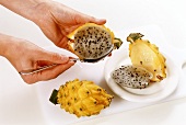 Scooping the flesh out of a pitahaya