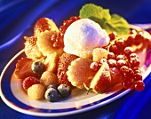 Berries with sponge and vanilla ice cream