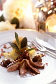 Duck breast, carved, with fruit and dumplings