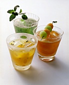 Three cocktails: papaya & melon; kiwi & melon; passion fruit
