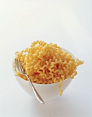 A bowl of fusilli with fork