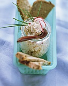 Wholemeal bead with a jar of radish cream cheese (Obatzter)