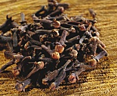 Cloves on brown background