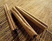 Cinnamon sticks on brown background