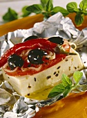 Baked sheep's cheese with olives and chili peppers