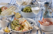 White asparagus with shrimps and green ribbon noodles