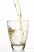 Pouring apple juice into a glass