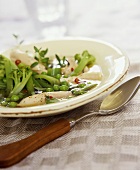 Chicken soup with ginger, celery and peas