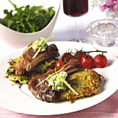 Lamb cutlets with rosti and cherry tomatoes