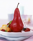 Red wine pear, decorated with fresh fruit