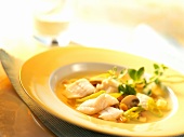 Clear broth with plaice fillet and vegetables 