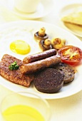 British mixed grill with various sausages and meat