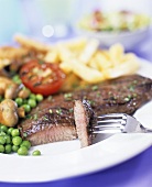 Beef steak with vegetables and chips