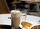 Latte macchiato with croissant