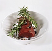 Hare fillet with sprig of rosemary