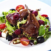Lamb chops with raspberries on Greek salad