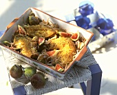 Oven-baked rabbit with onions and figs