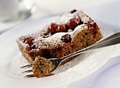 A piece of cherry and poppy seed cake