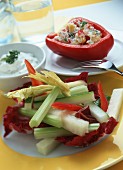 Raw vegetable sticks with cress dip and stuffed peppers