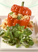 Stuffed red peppers with rice & cheese stuffing, corn salad