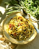 Spaghetti with herbs, garlic, olives, cheese and salami