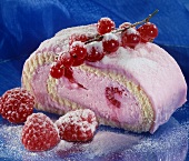 A piece of raspberry sponge roulade