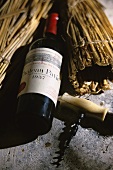 Chateau Pavie, 1937 vintage, corkscrew beside it, S. Emillon