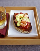 Toasted farmhouse bread with pepper, avocado and shrimps