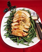 Turkey breast with pine nuts on beans