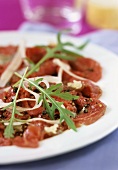 Carpaccio (Slices of raw beef with Parmesan and rocket)
