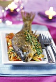Trout with thyme on bed of vegetables
