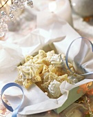Coconut stars with meringue rosettes in gift box
