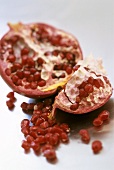 Pomegranate, cut open, and pomegranate seeds