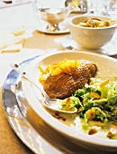 Goose breast with orange sauce and savoy