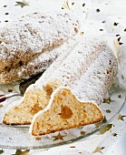 Christmas stollen with marzipan filling, a piece cut