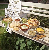 Cold buffet with Provencal dishes on a bench