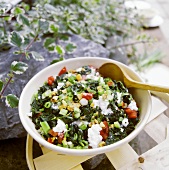 Steamed spinach with walnuts and soft cheese