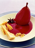 Red wine pear with cheese and star anise