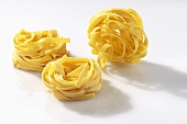 Three ribbon noodle nests