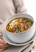 Thai-style soup with sprouts and mushrooms