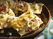 Pasta parcels filled with forcemeat, bacon and spinach