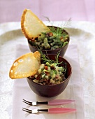 Cucumber and olive salad in two small bowls
