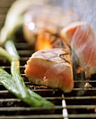 Tuna steak on the barbecue, a piece cut off