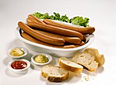 Sausages, mustard, Dijon mustard, ketchup & baguette slices