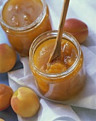Peach jam in preserving jars