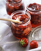 Strawberry jam in preserving jars