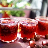 Red gooseberry jam in preserving jars