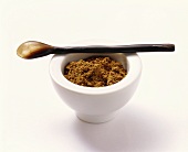 Garam masala (spice mixture) in a white mortar