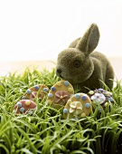 Easter biscuits (Easter eggs) & plush bunny on Easter grass